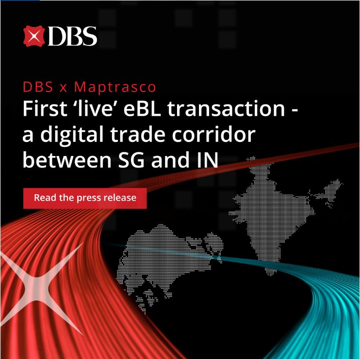 DBS and Maptrasco representatives shaking hands after successful electronic bills of lading transaction.