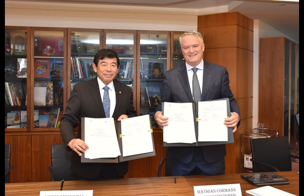 WCO Secretary General Dr. Kunio Mikuriya and OECD Secretary General Mr. Mathias Cormann signing MoU.