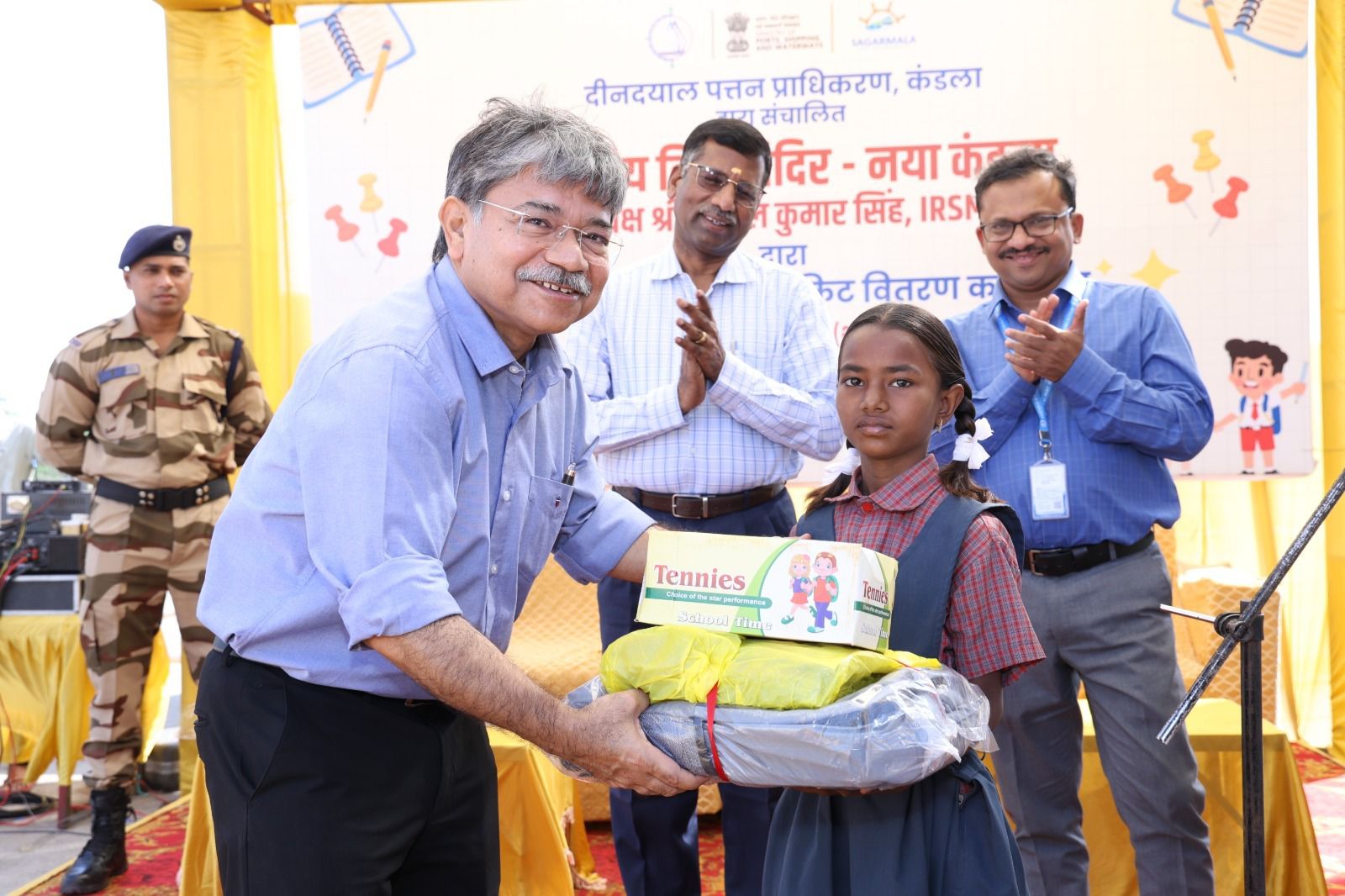 Shri Sushil Kumar Singh IRSME, Chairman DPA, encourages education and distributes school essentials to all the students of Bhartiya Vidya Mandir, Kandla